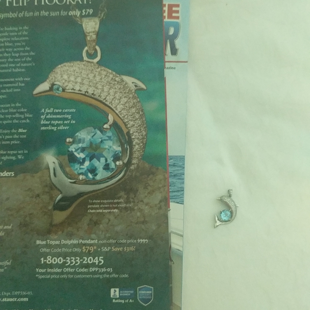 Blue topaz dolphin pendant no chain as seen in picture retail 79